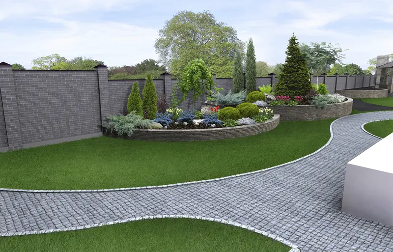 Curved cobblestone paver path in a modern landscaped garden Curved cobblestone paver path in a modern landscaped garden